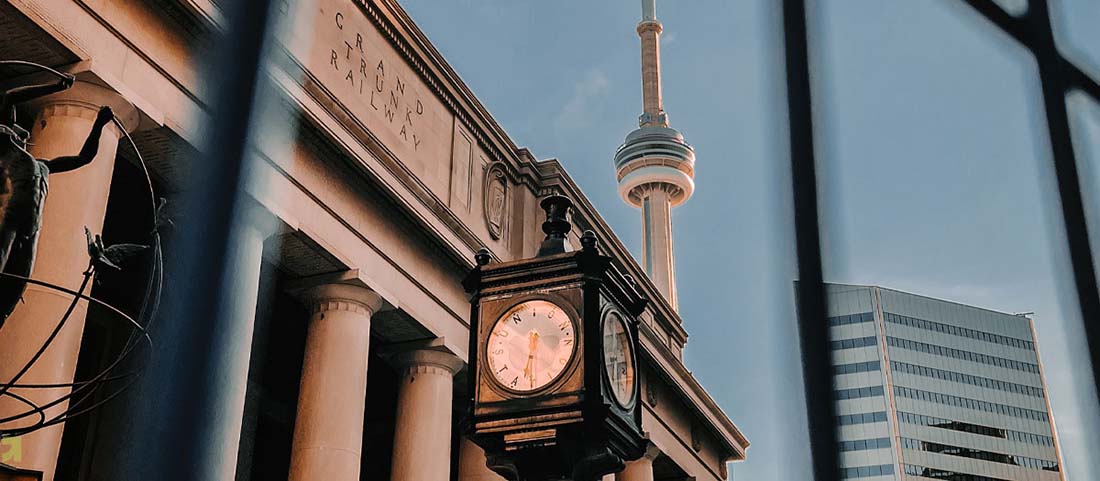 union station clock with cn tower in background